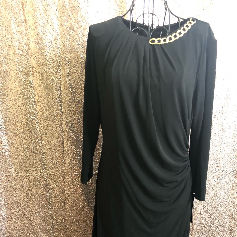 Long sleeve black dress with gold chain accent